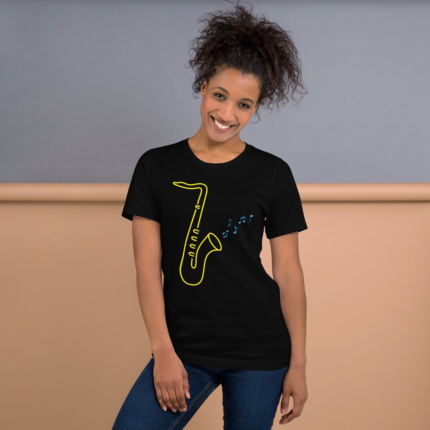 Black T-Shirt with a vibrant design of a yellow saxophone and blue musical notes, from the TEQNEON Music Box collection. Titled 'GOLDEN SAXOPHONE'