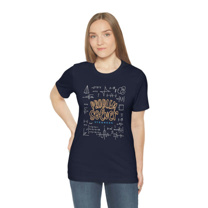 Navy T-Shirt with centred 'Problem Solver' text, featuring 'hashtag TEQNEON' in muted blue, surrounded by intricate white mathematical symbols. From the TEQNEON Word Craft collection