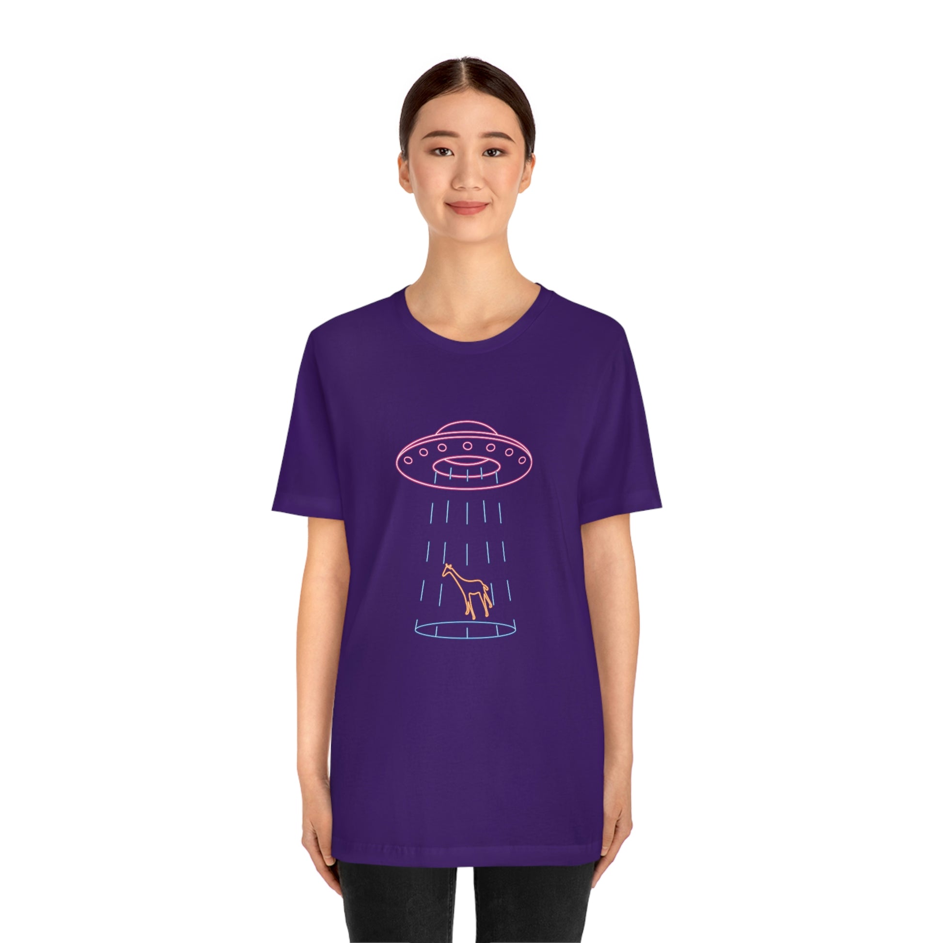 Purple T-Shirt with fun multi-coloured neon design of a ufo beaming up a giraffe. Taken from the TEQNEON Ha Ha Land collection