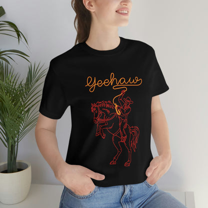 Black T-Shirt featuring a neon design of a cowboy with a lasso saying 'yeehaw' in yellow and red, from the TEQNEON Word Craft collection