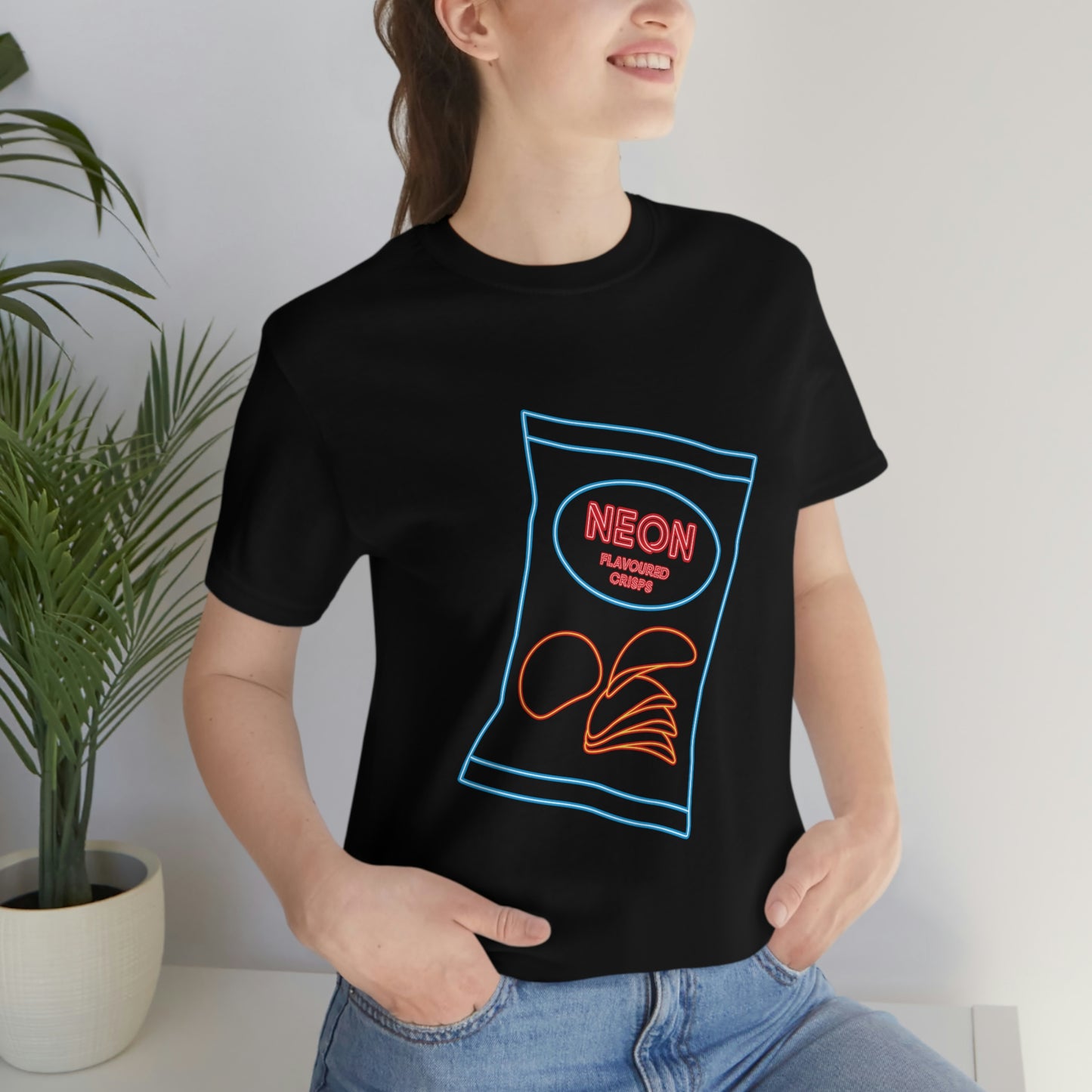 Black T-Shirt with multi-coloured 'neon crisp packet' design. Taken from the TEQNEON Ha ha Land and Word Craft collections.