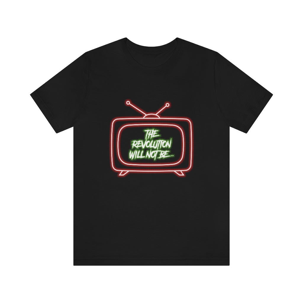 Black T-Shirt with a bold white and green text proclaiming 'The Revolution Will Not Be...' inside a red neon-styled television. From the TEQNEON Word Craft collection