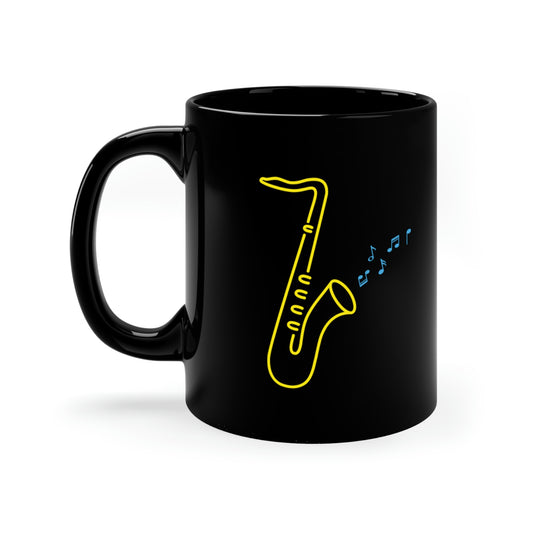 Black Mug with a vibrant neon design of a yellow saxophone and blue musical notes, from the TEQNEON Music Box and Accessories collections